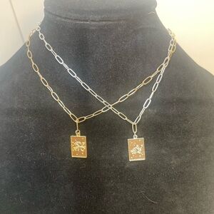 Two Gold and Silver Tone Capricorn Pendant Necklaces